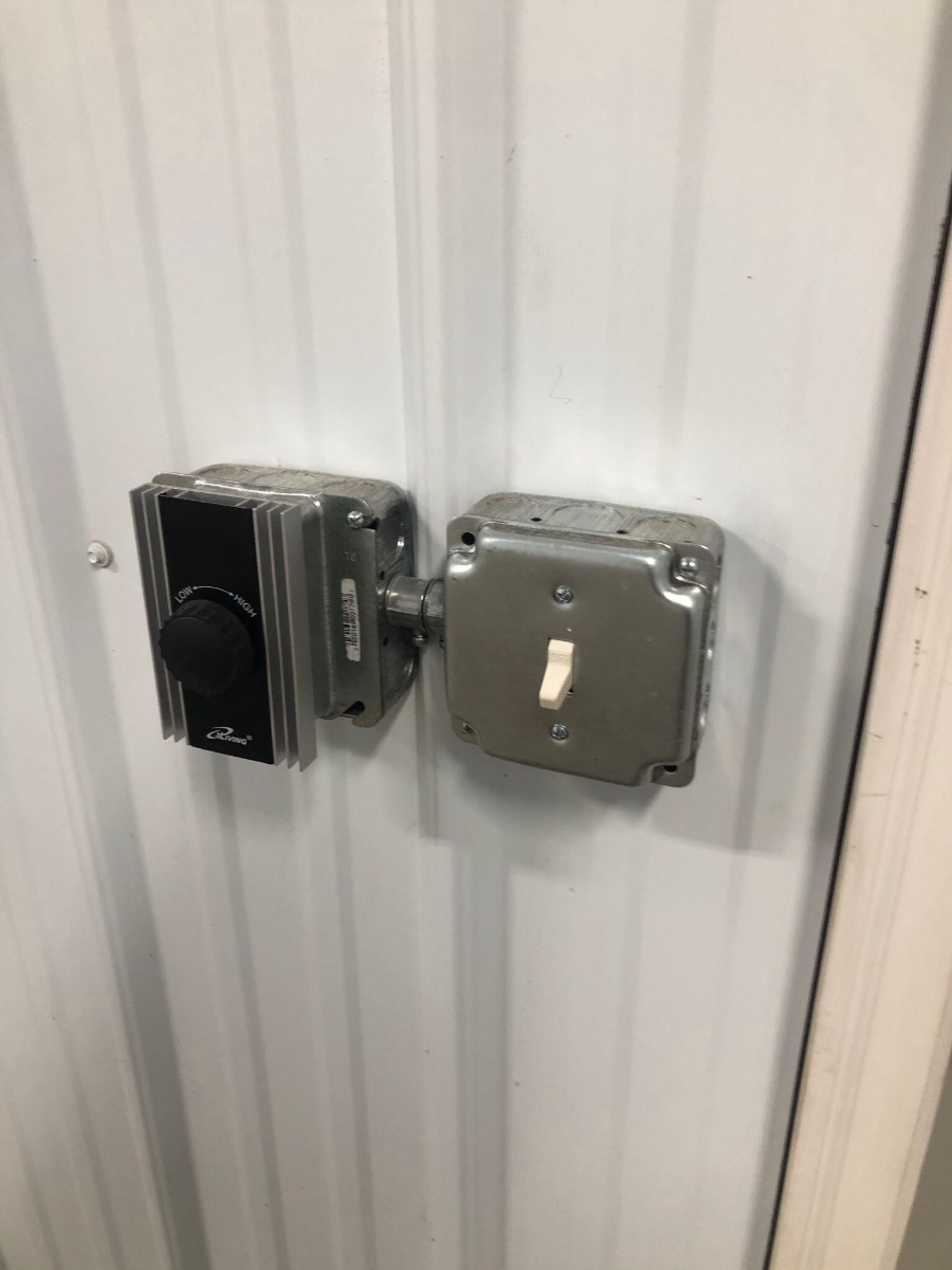 Metal interior siding in shop flush mount electrical boxes